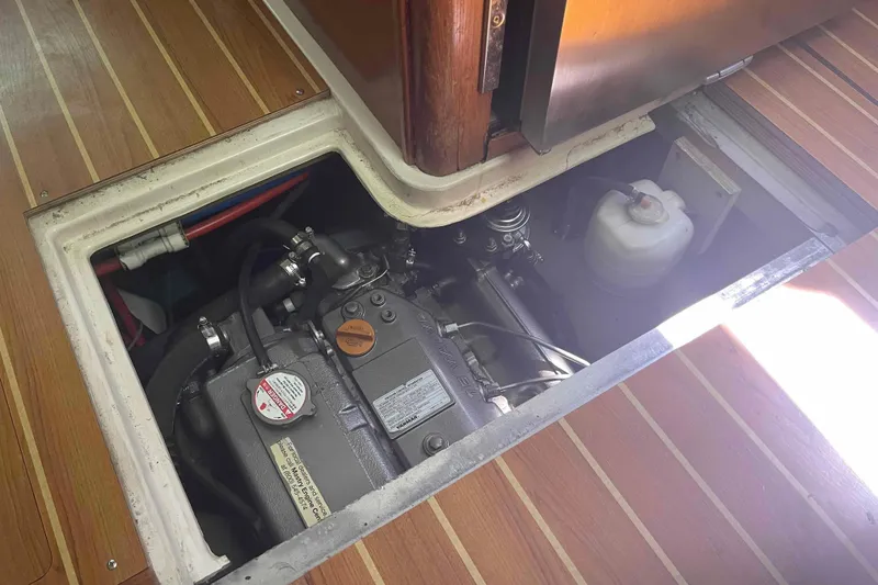 Slide: The Image of Engine compartment of a 2013 Catalina Morgan 440 sailboat, showcasing mechanical components. - 28