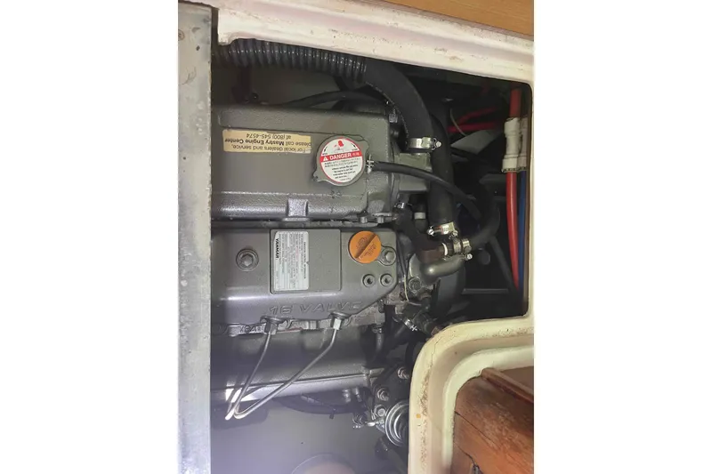 Slide: The Image of Engine compartment of a 2013 Catalina Morgan 440 sailboat, showing detailed mechanical components. - 29