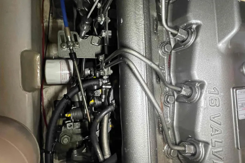 Slide: The Image of Close-up of a 2013 Catalina Morgan 440 engine, showcasing intricate mechanical components. - 31