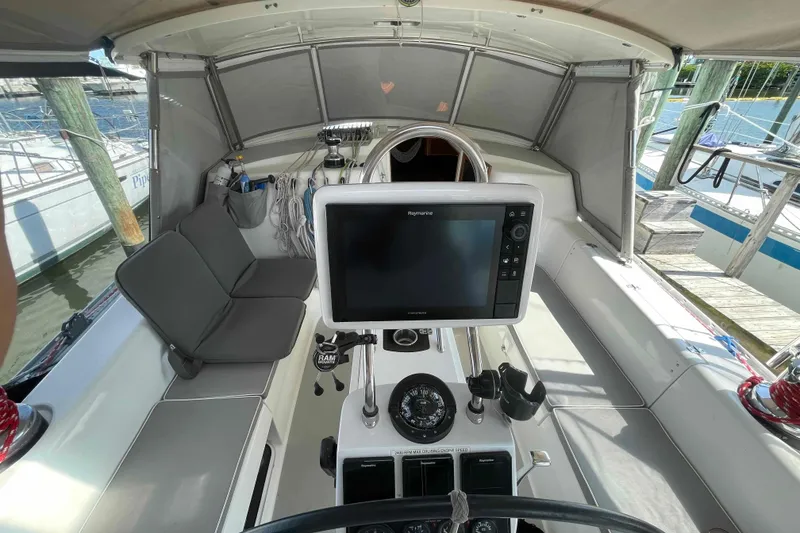 Slide: The Image of Cockpit of 2013 Catalina Morgan 440 sailboat with navigation equipment and seating. - 41