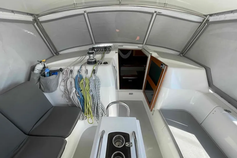 Slide: The Image of Interior view of 2013 Catalina Morgan 440 sailboat cockpit with seating and ropes. - 44