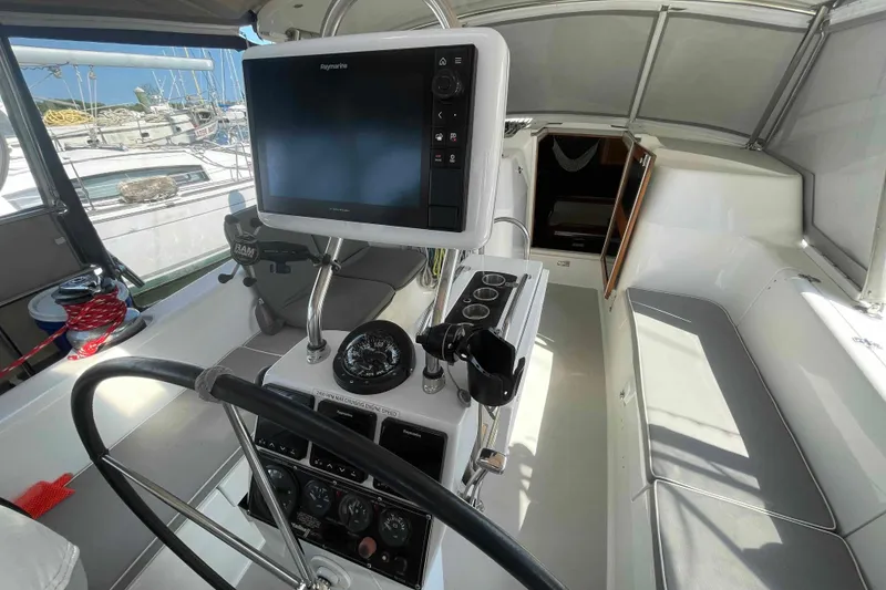 Slide: The Image of Cockpit of 2013 Catalina Morgan 440 sailboat with navigation equipment and steering wheel. - 48