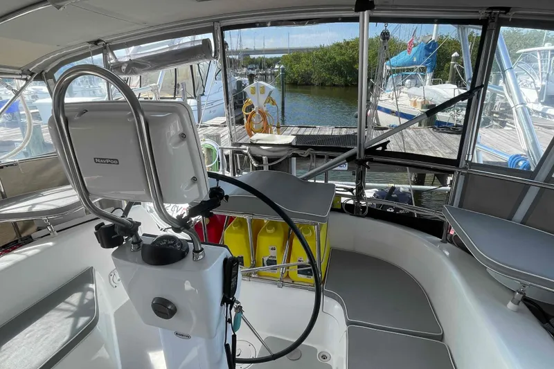 Slide: The Image of Cockpit of 2013 Catalina Morgan 440 sailboat with navigation equipment and dock view. - 49