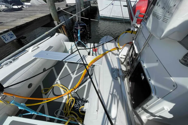 Slide: The Image of Catalina Morgan 440 sailboat docked, featuring deck equipment and mooring lines, 2013 model. - 54