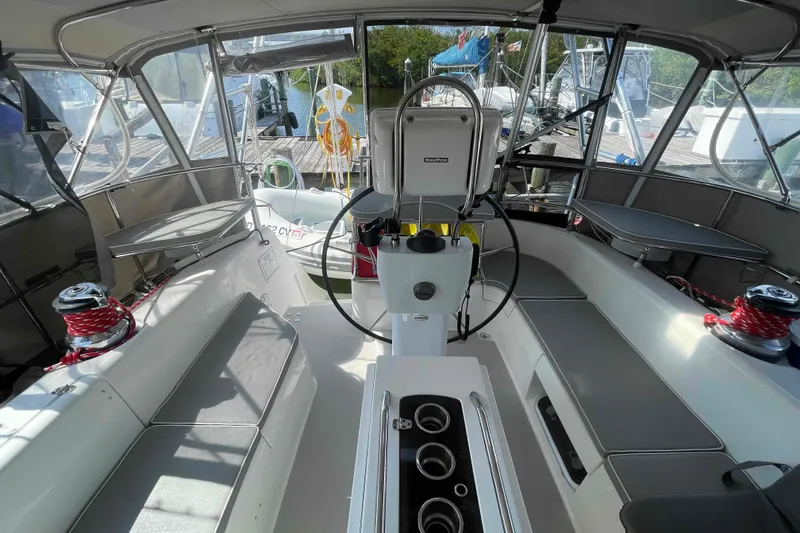 Slide: The Image of Cockpit of 2013 Catalina Morgan 440 sailboat with steering wheel and seating. - 55
