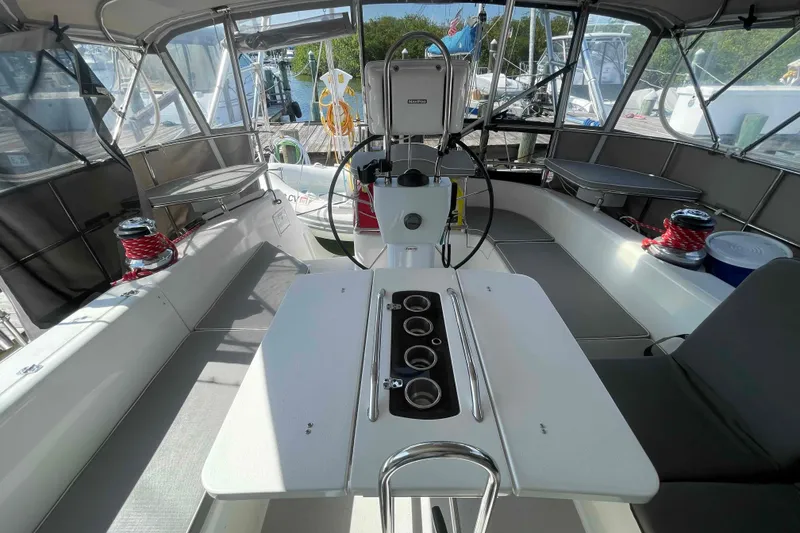 Slide: The Image of Cockpit of 2013 Catalina Morgan 440 sailboat with steering wheel and seating area. - 56
