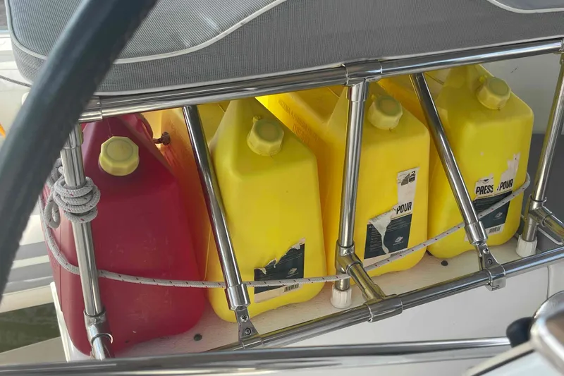 Slide: The Image of Yellow and red fuel containers on a 2013 Catalina Morgan 440 sailboat deck. - 59