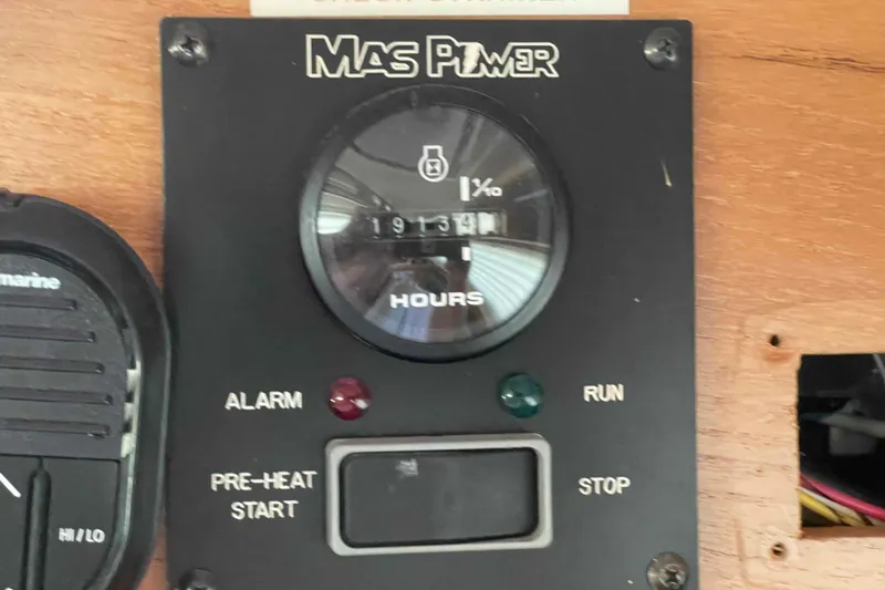 Slide: The Image of Engine hour meter on a 2013 Catalina Morgan 440 sailboat dashboard. - 66