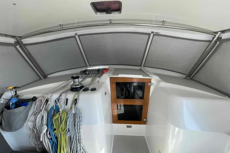 Slide: The Image of Interior view of a 2013 Catalina Morgan 440 sailboat cockpit with ropes and equipment. - 67