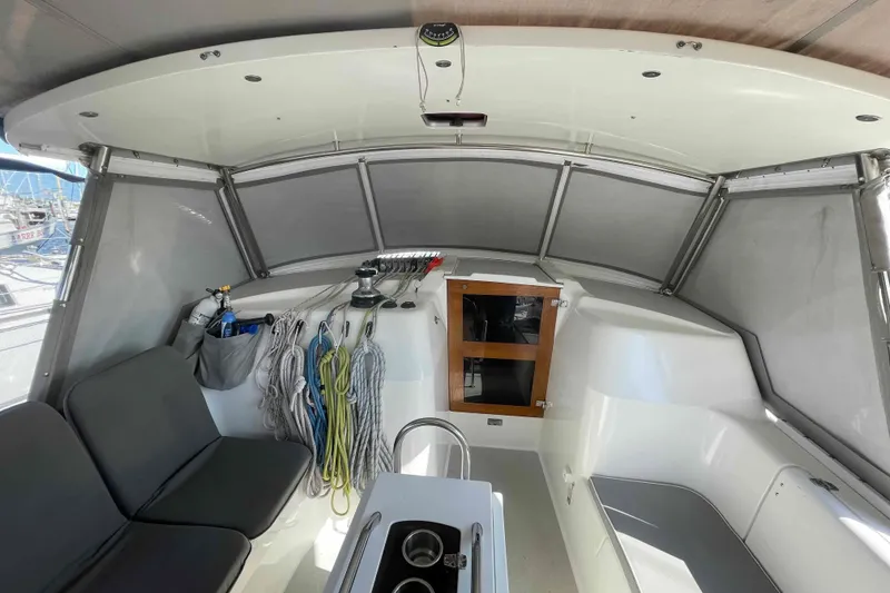 Slide: The Image of Interior view of 2013 Catalina Morgan 440 sailboat cockpit with seating and storage. - 68