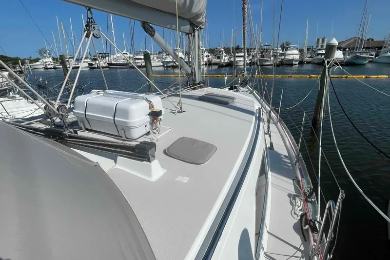 Slide: The Image of 2013 Catalina Morgan 440 sailboat docked at marina, showcasing deck and rigging. - 69