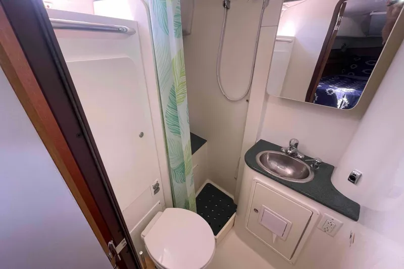 Slide: The Image of Compact bathroom in 2013 Catalina Morgan 440 yacht with shower, sink, and toilet. - 7