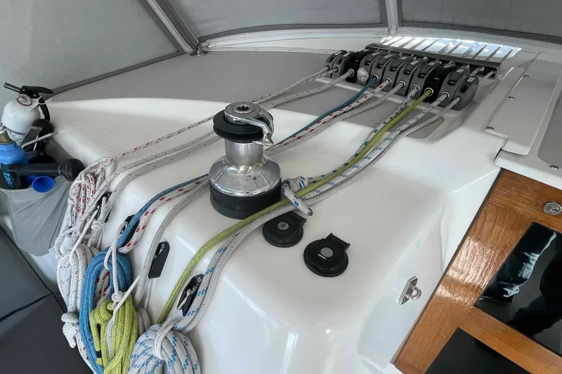 Slide: The Image of Sailing equipment on a 2013 Catalina Morgan 440 yacht, featuring winches and ropes. - 85