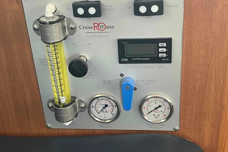 Slide: The Image of Control panel of a 2013 Catalina Morgan 440 water system with gauges and valves. - 9