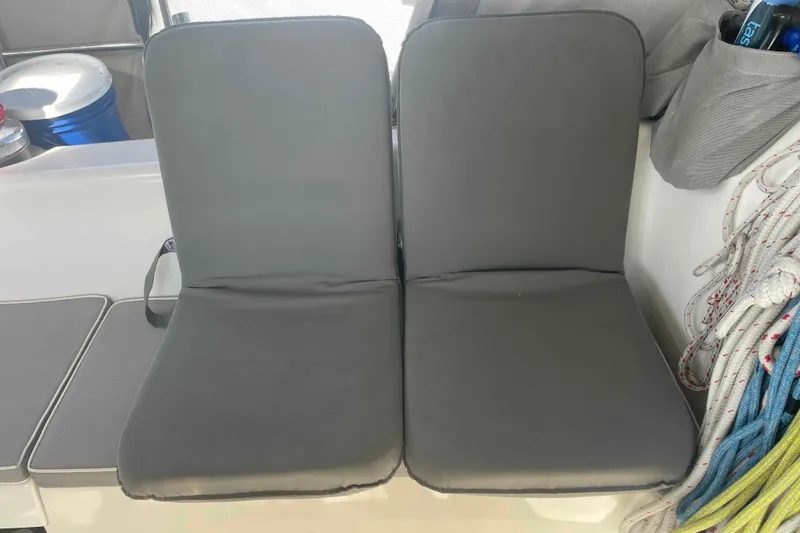 Slide: The Image of Gray cushioned seats on a 2013 Catalina Morgan 440 boat deck. - 90