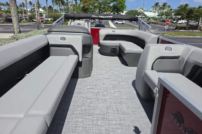 Slide: The Image of 2026 Sun Tracker Party Barge 18 DLX interior with gray seating and spacious layout. - 4