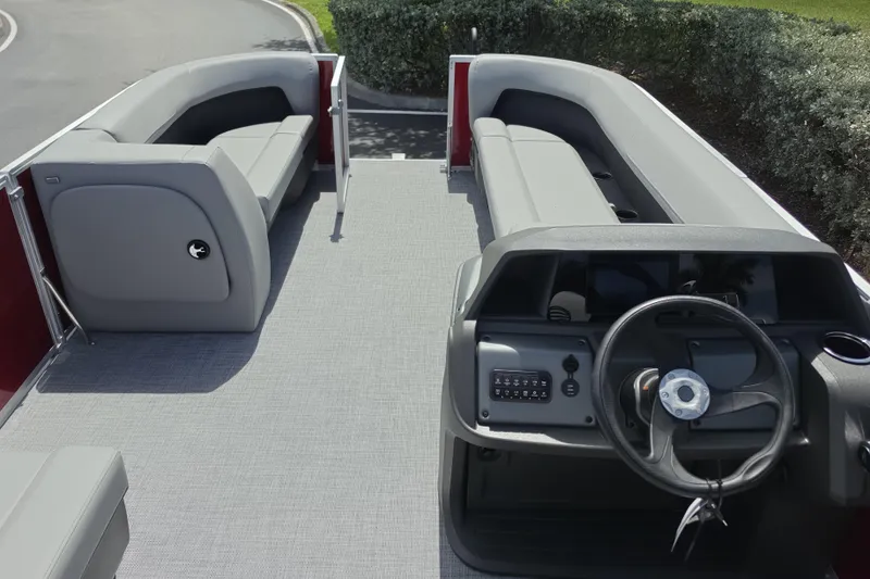 Slide: The Image of 2026 Sun Tracker Party Barge 18 DLX interior with spacious seating and modern helm. - 5
