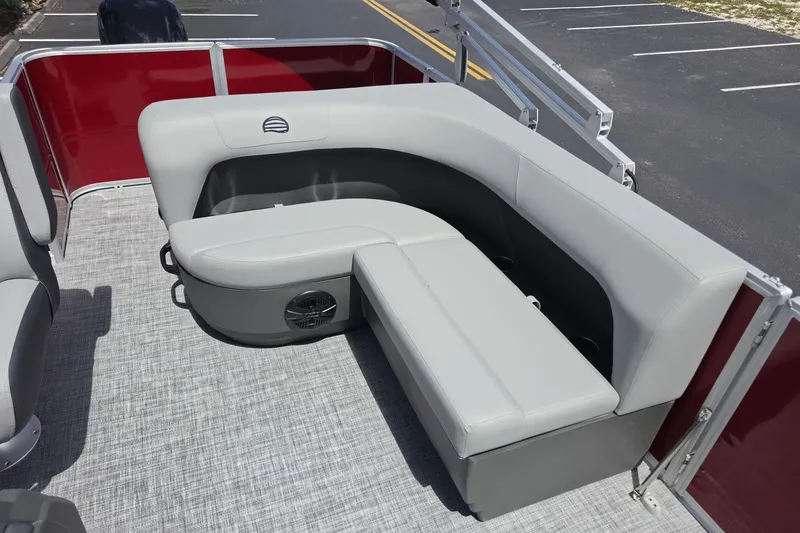 Slide: The Image of 2026 Sun Tracker Party Barge 18 DLX with gray seating and red paneling. - 9