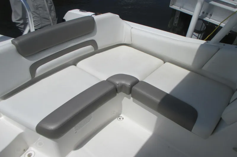 Slide: The Image of 2020 World Cat 230 SD boat on a sunny day with blue sky and clouds. - 10