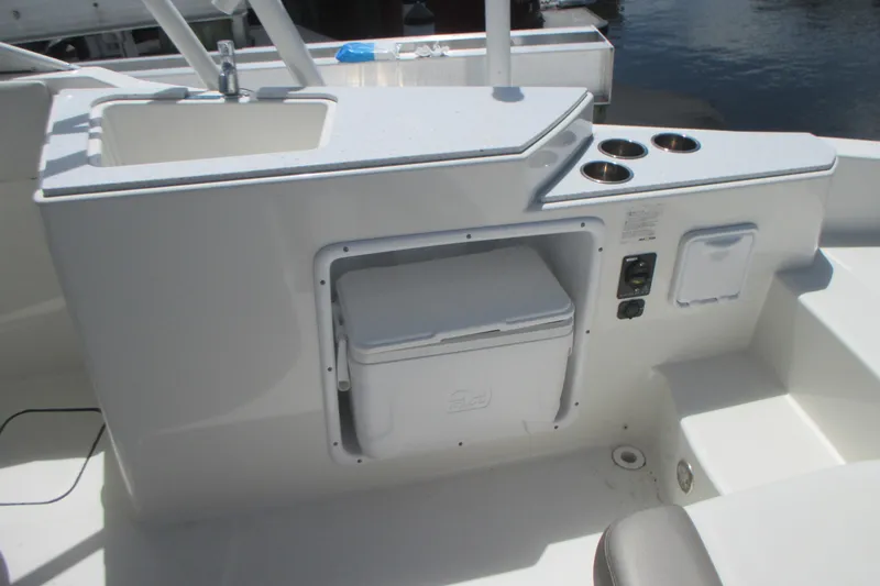 Slide: The Image of Steering console of 2020 World Cat 230 SD boat with navigation display and controls. - 12