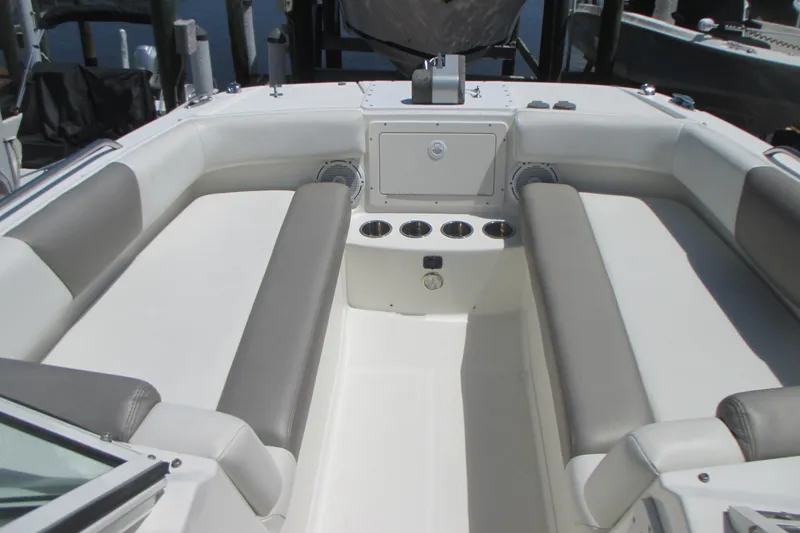 Slide: The Image of 2020 World Cat 230 SD boat interior with gray and white seating arrangement. - 17