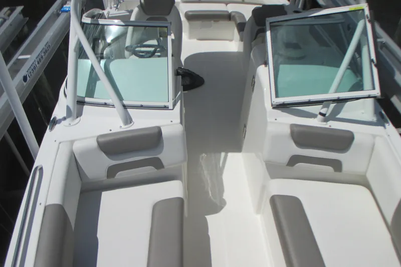 Slide: The Image of 2020 World Cat 230 SD boat interior with seating and windshield. - 23