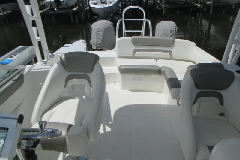 Slide: The Image of 2020 World Cat 230 SD boat named "Cloud Nine" docked at a marina. - 7