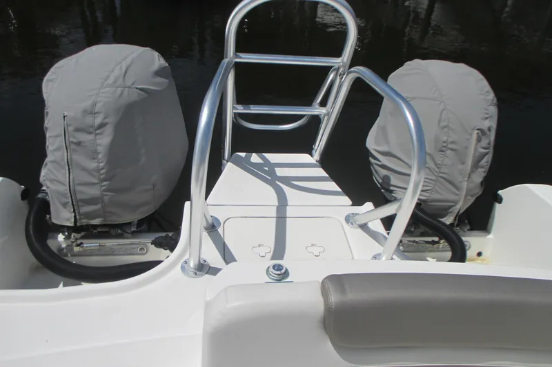 Slide: The Image of 2020 World Cat 230 SD boat docked, featuring deck details and mooring equipment. - 9