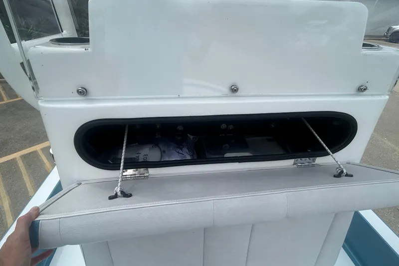 Slide: The Image of Storage compartment on a 2026 Shallow Sport 22 Sport boat, open and accessible. - 10