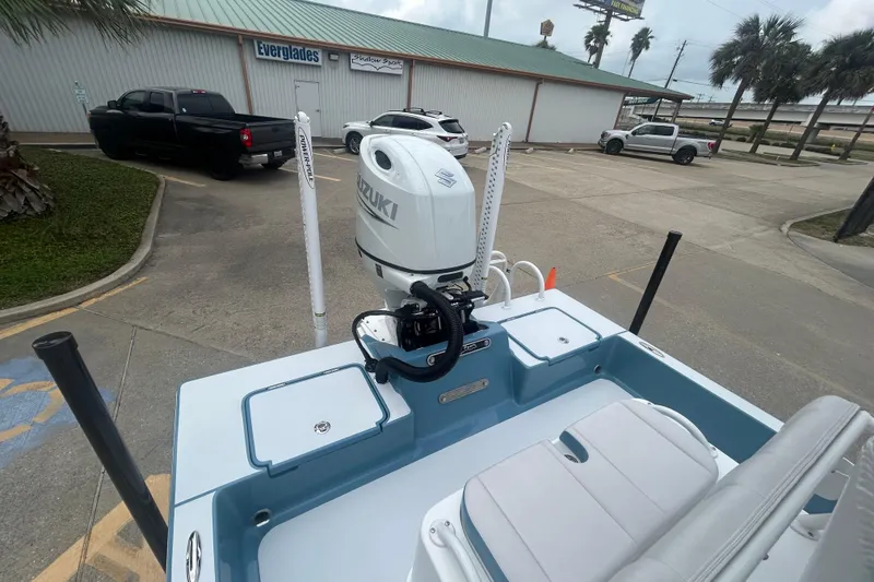 Slide: The Image of 2026 Shallow Sport 22 Sport boat with Suzuki outboard motor in parking lot. - 13