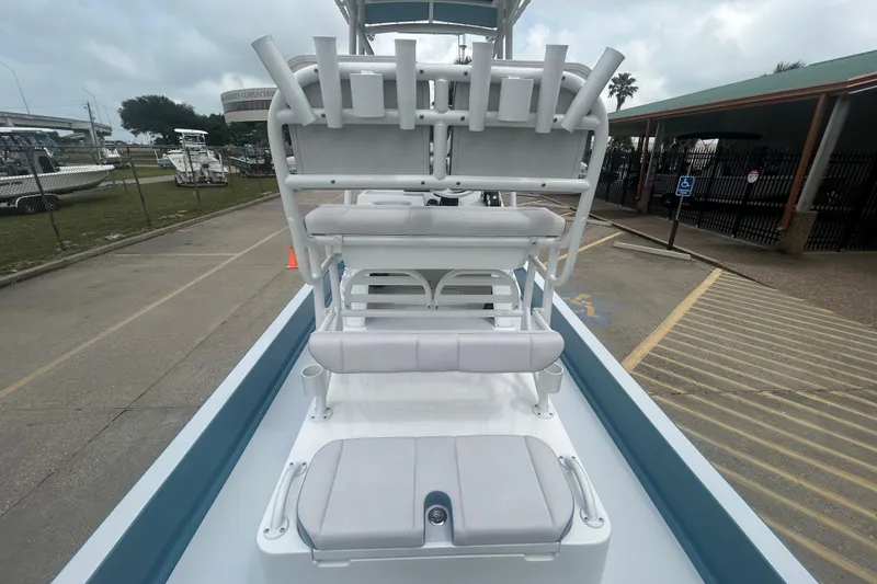 Slide: The Image of 2026 Shallow Sport 22 Sport boat interior with seating and rod holders. - 14