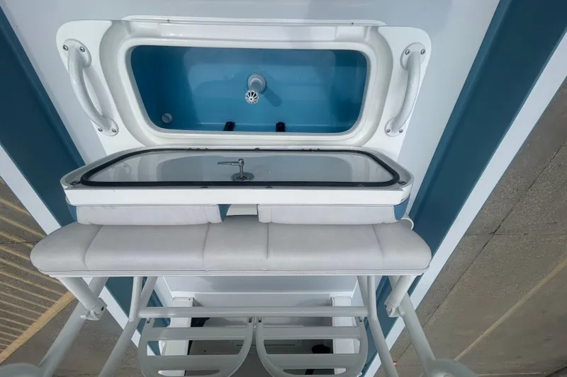Slide: The Image of Interior view of 2026 Shallow Sport 22 Sport boat, featuring a sleek storage compartment. - 15