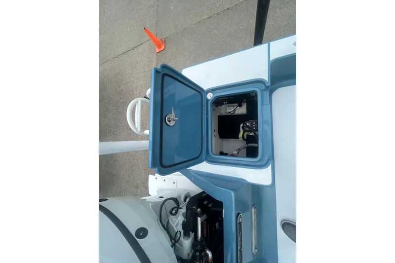 Slide: The Image of Open storage compartment on a 2026 Shallow Sport 22 Sport boat, showcasing interior details. - 16