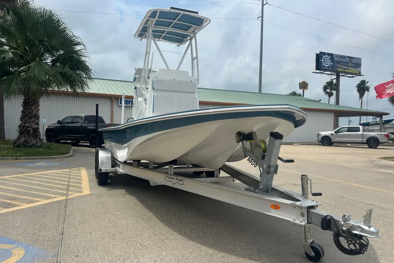 Slide: The Image of 2026 Shallow Sport 22 Sport boat on trailer in parking lot. - 3