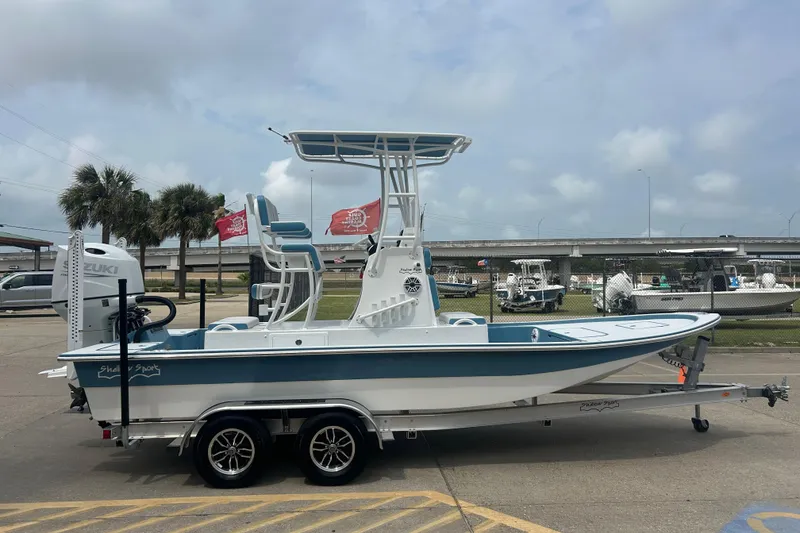 Slide: The Image of 2026 Shallow Sport 22 Sport boat on trailer, outdoor display. - 4