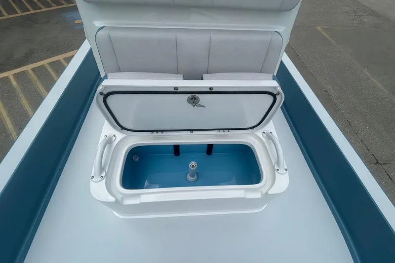 Slide: The Image of Open storage compartment on 2026 Shallow Sport 22 Sport boat deck. - 7
