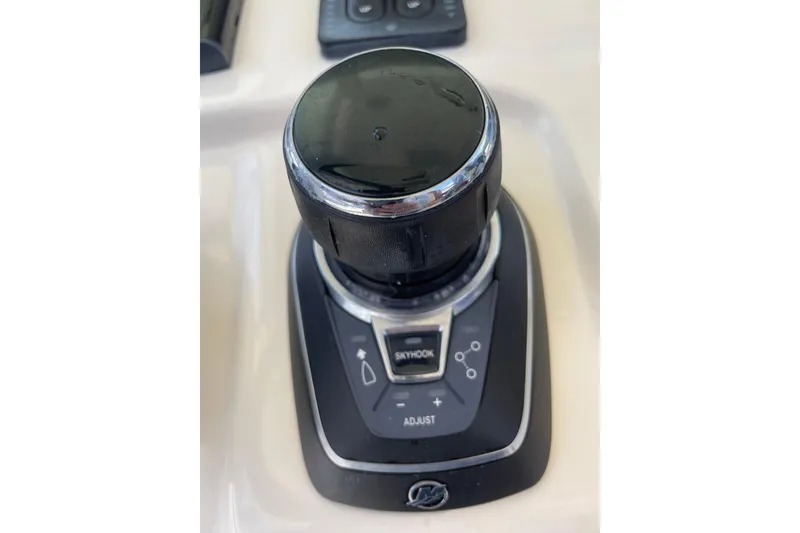 Slide: The Image of Joystick control on 2023 Scout 305 LXF boat dashboard. - 14