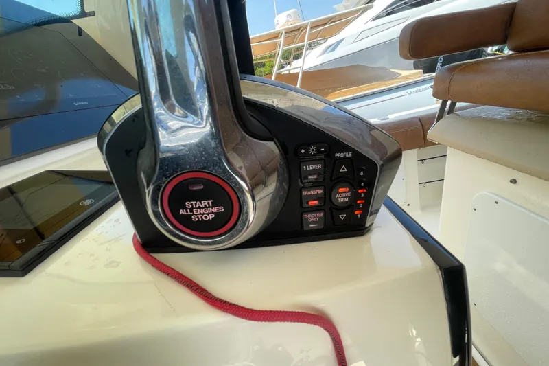 Slide: The Image of Control panel of 2023 Scout 305 LXF boat with engine start-stop button. - 15