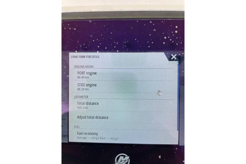 Slide: The Image of Display screen showing engine hours and odometer for 2023 Scout 305 LXF boat. - 17