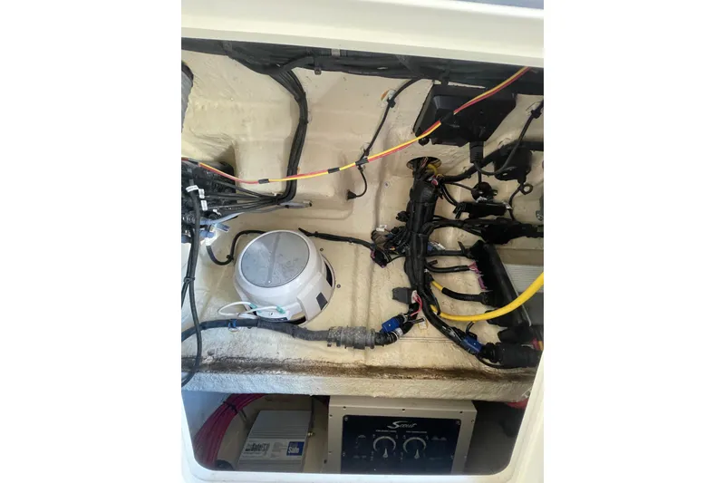 Slide: The Image of 2023 Scout 305 LXF boat wiring and equipment compartment. - 30