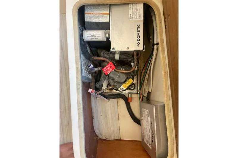 Slide: The Image of 2023 Scout 305 LXF boat electrical compartment with Dometic components. - 31