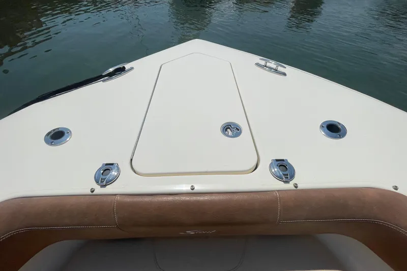 Slide: The Image of Bow view of 2023 Scout 305 LXF boat with sleek design and fittings. - 7