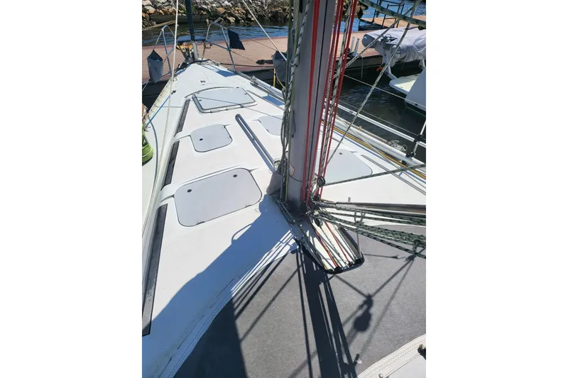 Slide: The Image of Deck view of a 1993 Hunter Legend 40.5 sailboat at a marina. - 21