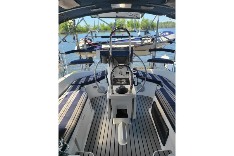 Slide: The Image of Interior view of 1993 Hunter Legend 40.5 sailboat cockpit with striped seating. - 4