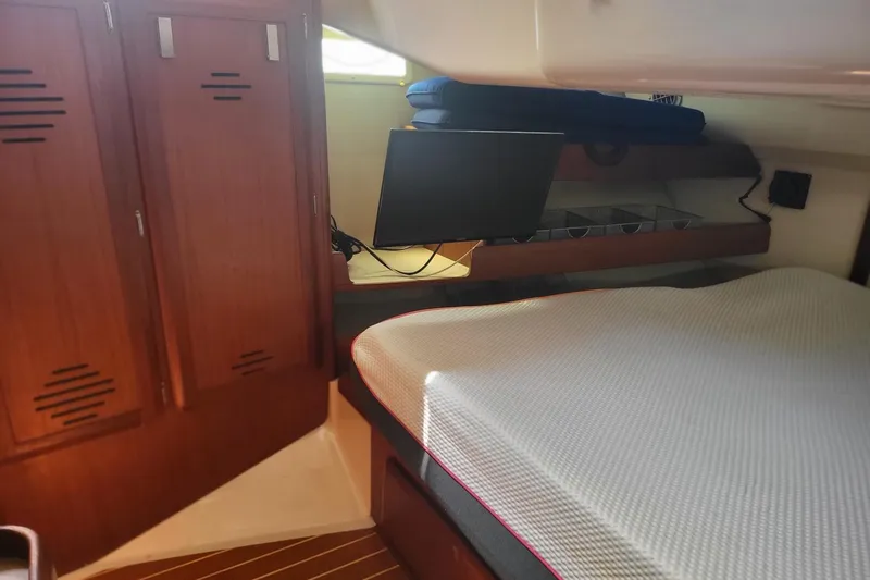 Slide: The Image of Cozy cabin interior of 1993 Hunter Legend 40.5 sailboat with wooden cabinets. - 6