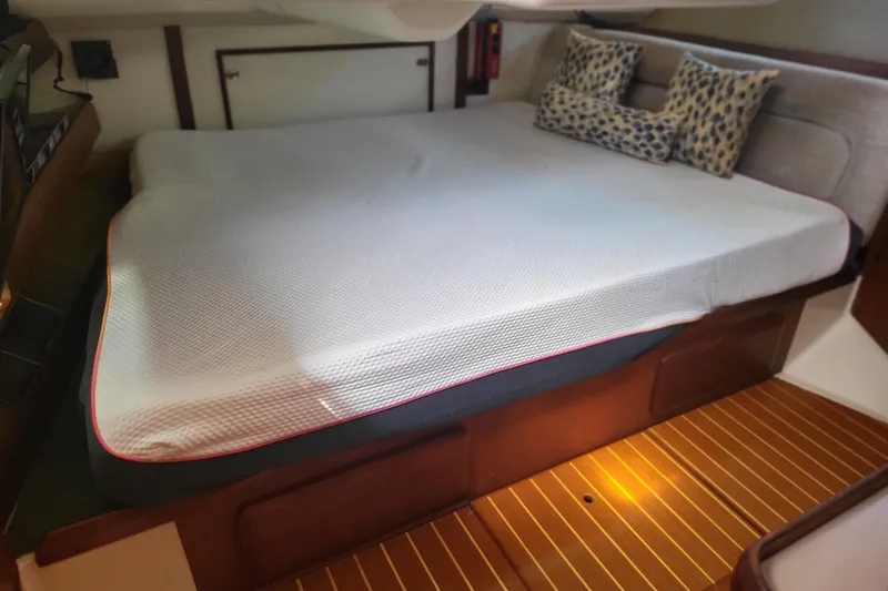 Slide: The Image of Cozy cabin interior of 1993 Hunter Legend 40.5 sailboat with comfortable bedding. - 7