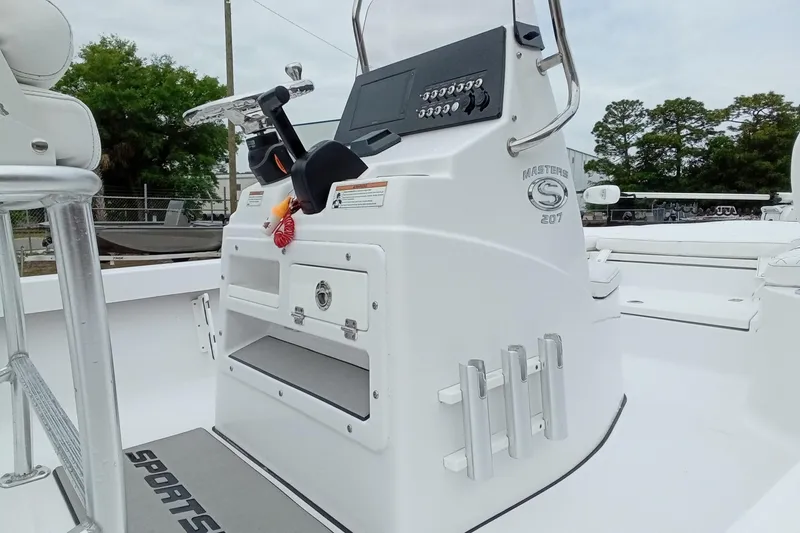Slide: The Image of 2021 Sportsman Masters 207 Bay Boat console with steering wheel and controls. - 11