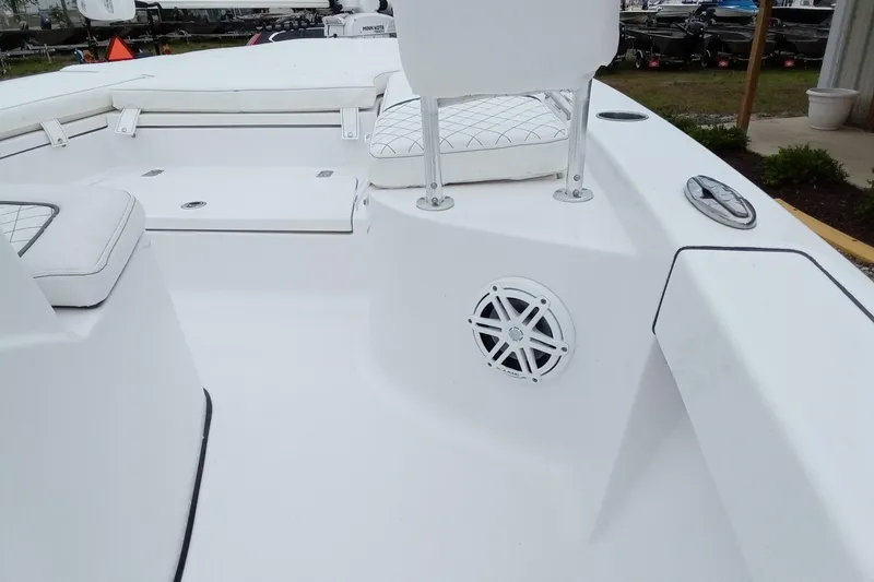 Slide: The Image of 2021 Sportsman Masters 207 Bay Boat interior with seating and speaker detail. - 14