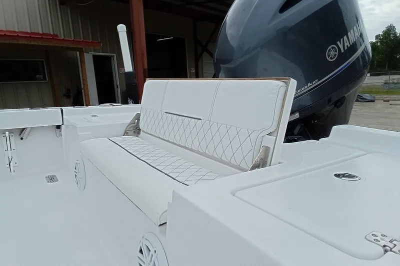 Slide: The Image of 2021 Sportsman Masters 207 Bay Boat with Yamaha engine and white seating. - 17