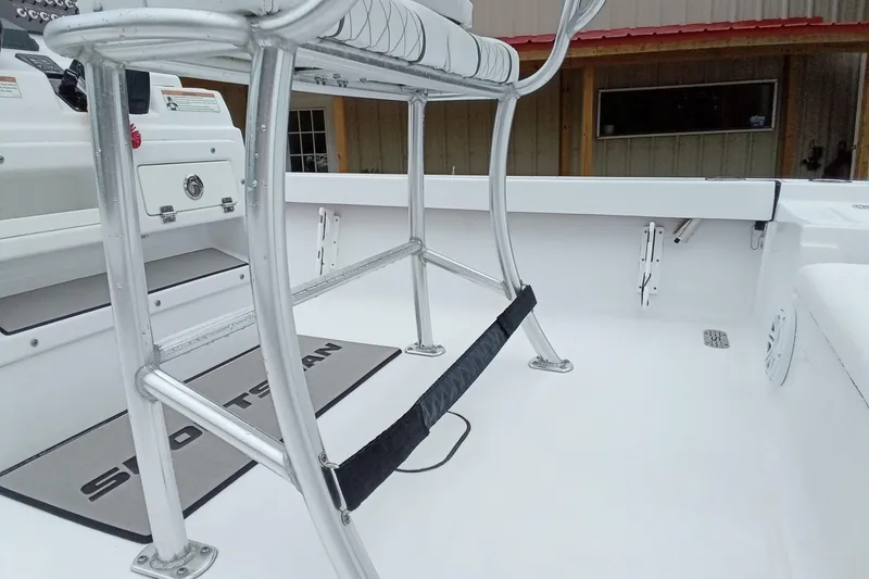 Slide: The Image of 2021 Sportsman Masters 207 Bay Boat interior with seating and console details. - 18